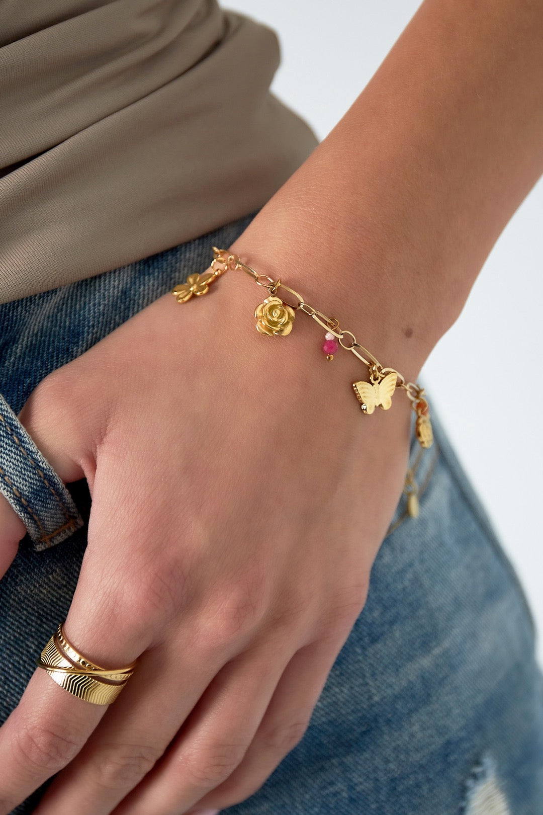 Lente bedels armband goud