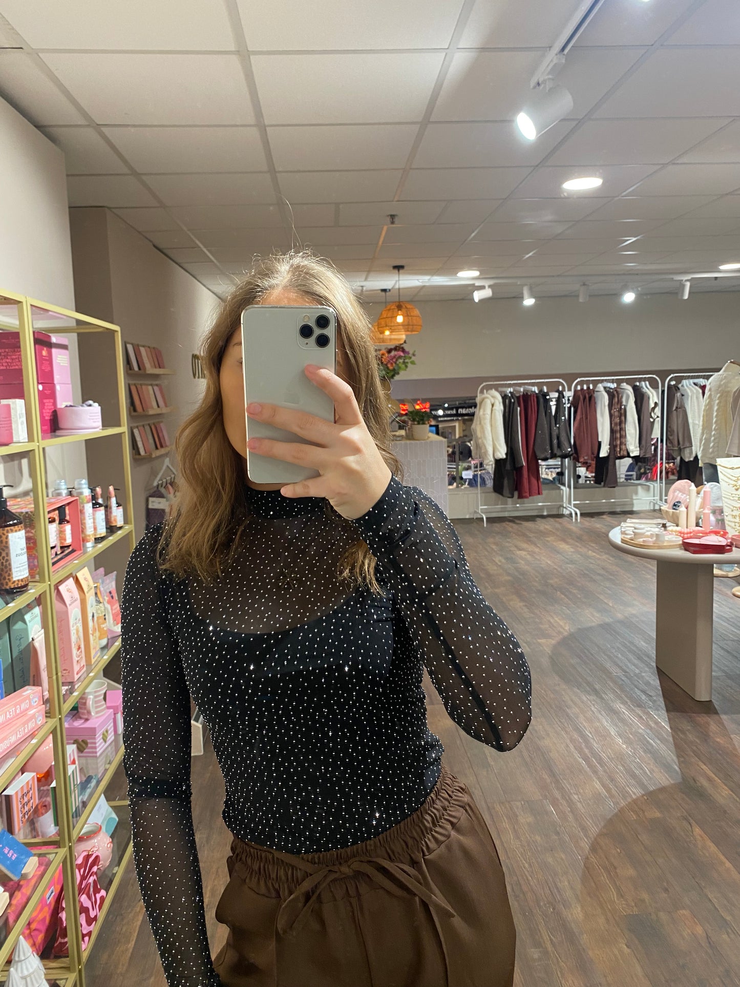 Zwarte mesh body met zilveren glitter, perfect voor een avondje uit of party.