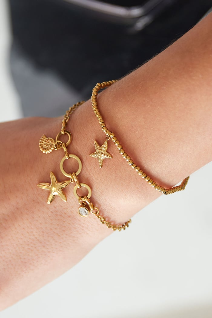 Kralen armband kleine zeester goud