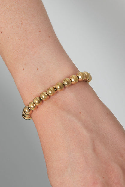Armband grote kralen goud
