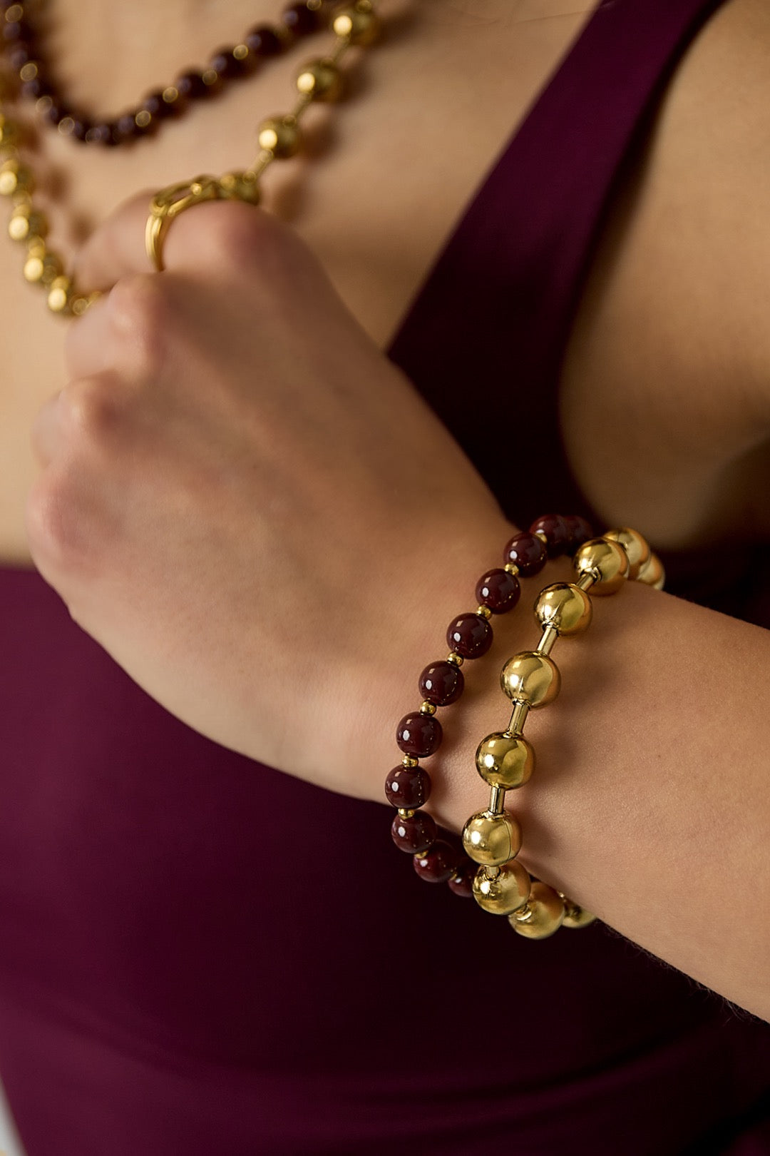 Armband kralen goud/bordeauxrood