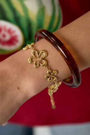 Koraalvormige speelse bloem armband goud