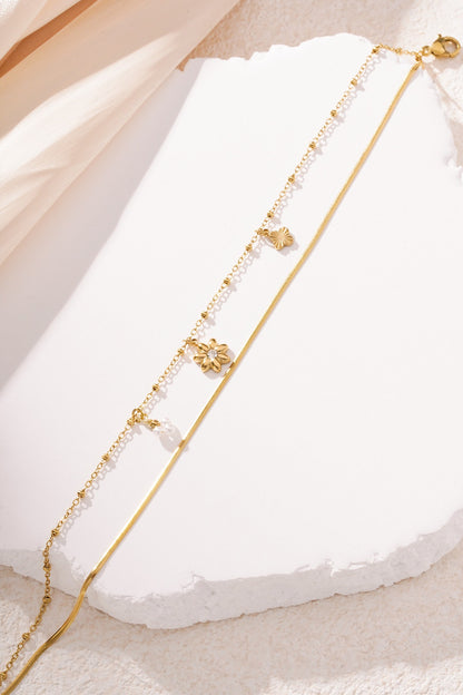 Bloemen armband goud