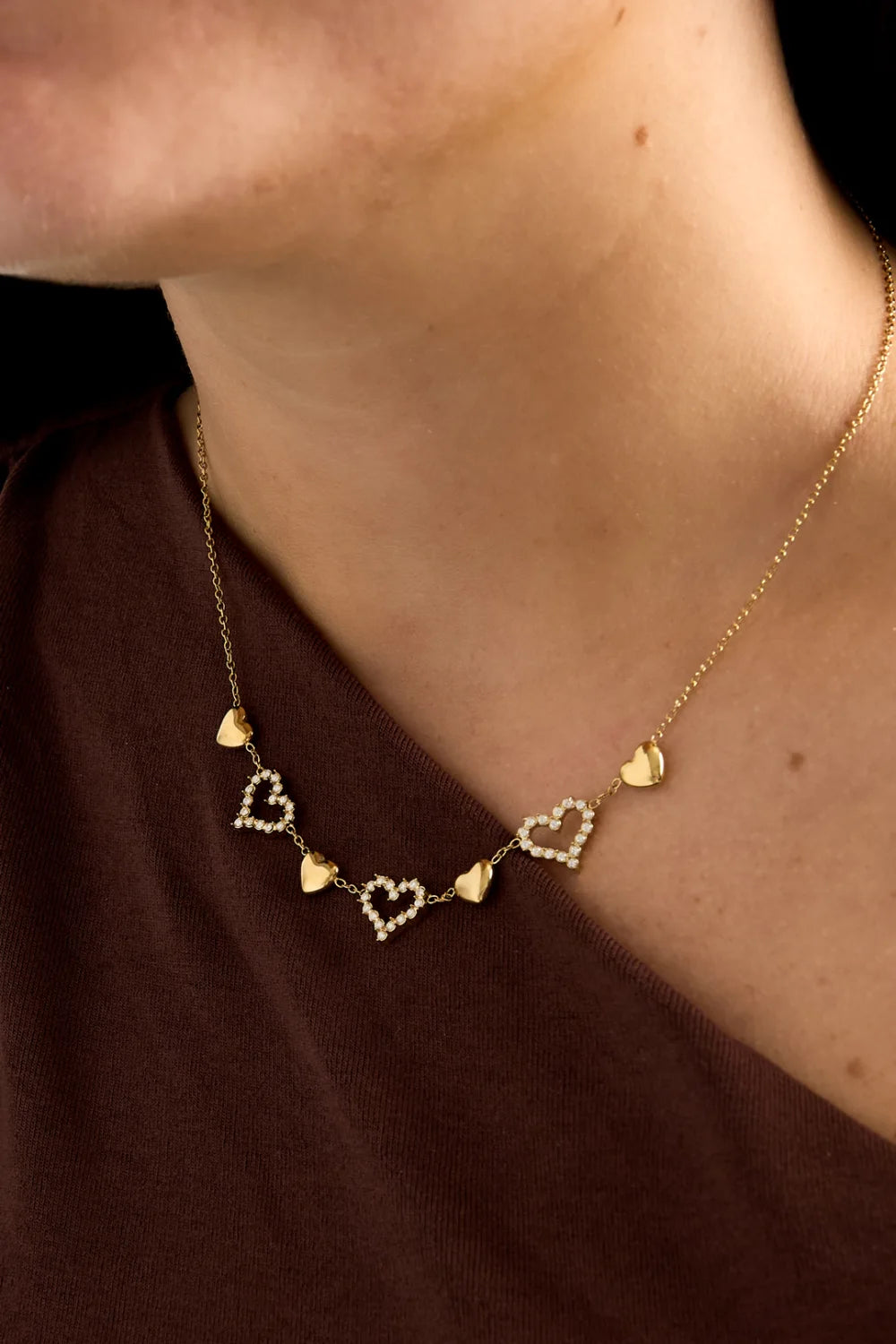 Afwisselende hartjes ketting goud