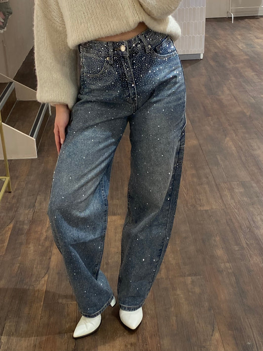 Blauwe balloon jeans met strass steentjes aan de zijkant.