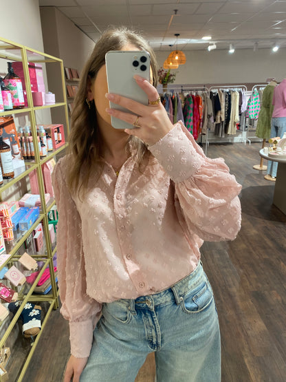 Blouse met ballonmouwen en strakke polsen.
