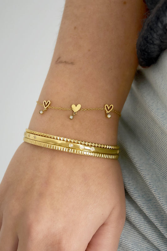 Hartjes met steentjes armband goud