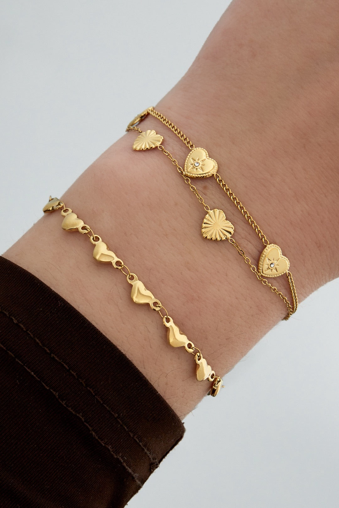 Multi hearts armband goud