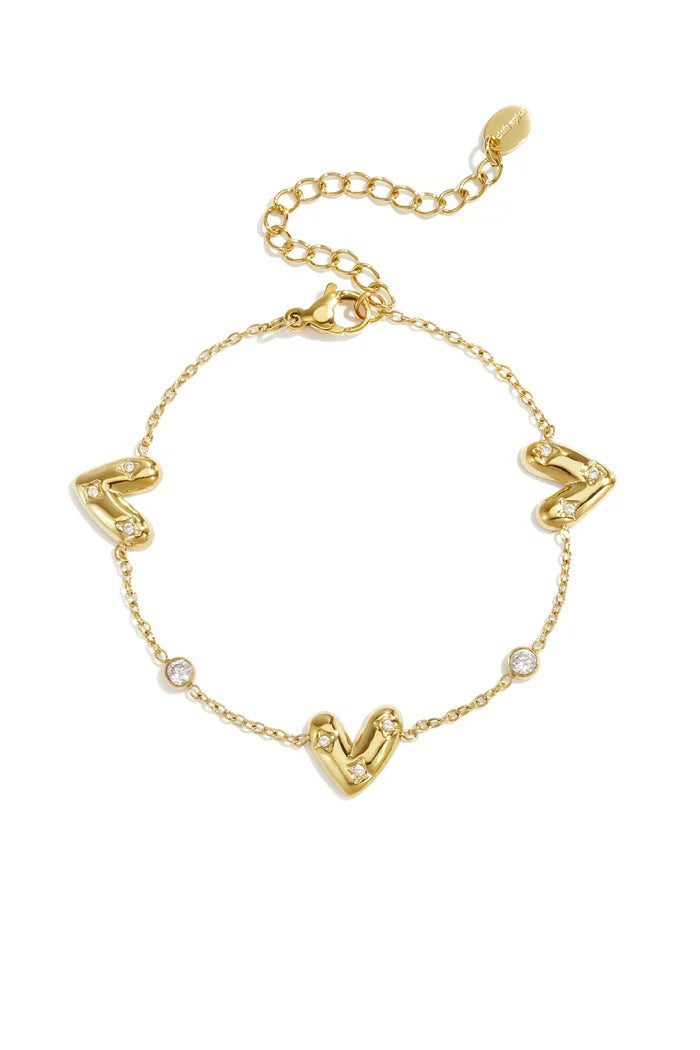Drie belegde harten en ronde zirkonia steentjes armband goud
