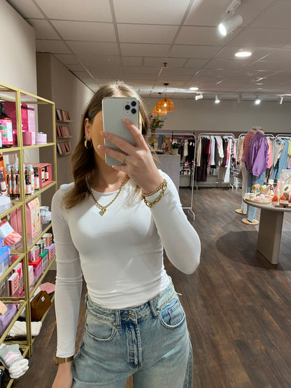 Stretch wit shirt met lange mouwen en zachte stof.