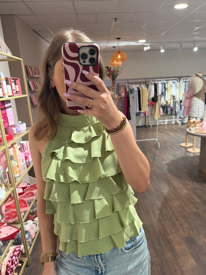 Groene top met vrouwelijke details 