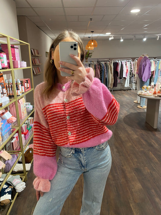 Roze rood gestreept vestje met ruffle mouwtjes.