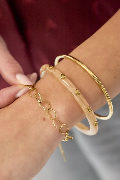 Hartjes gebundeld armband goud