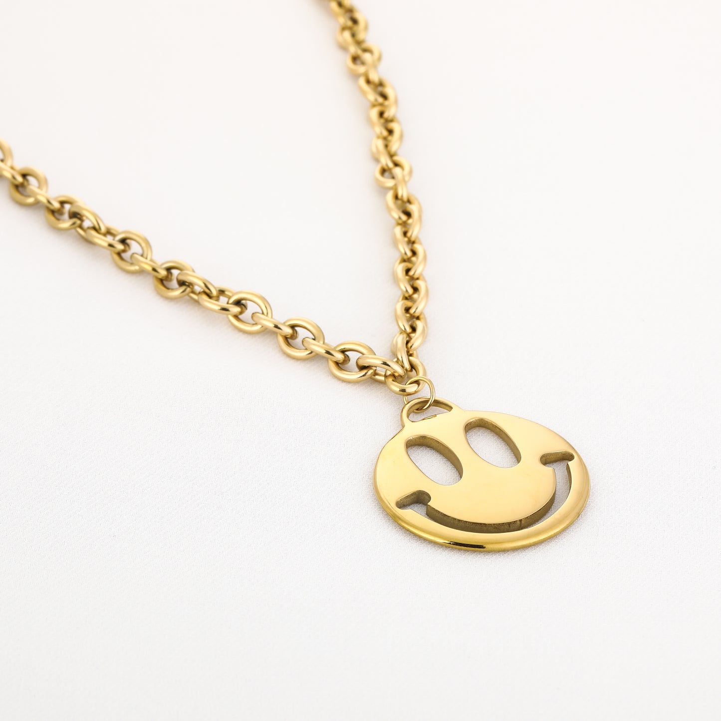 Lange smiley ketting goud