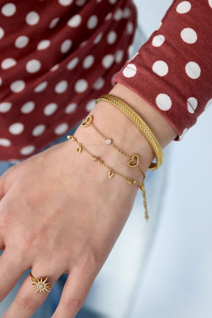 Open harten met steentjes armband goud