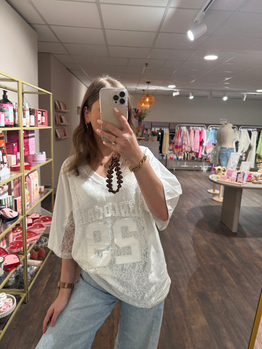 Oversized wit jersey shirt met kanten details.