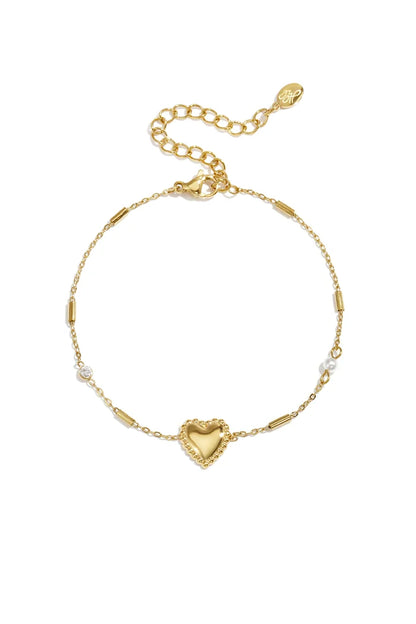Parel, steentje en statement hart armband goud