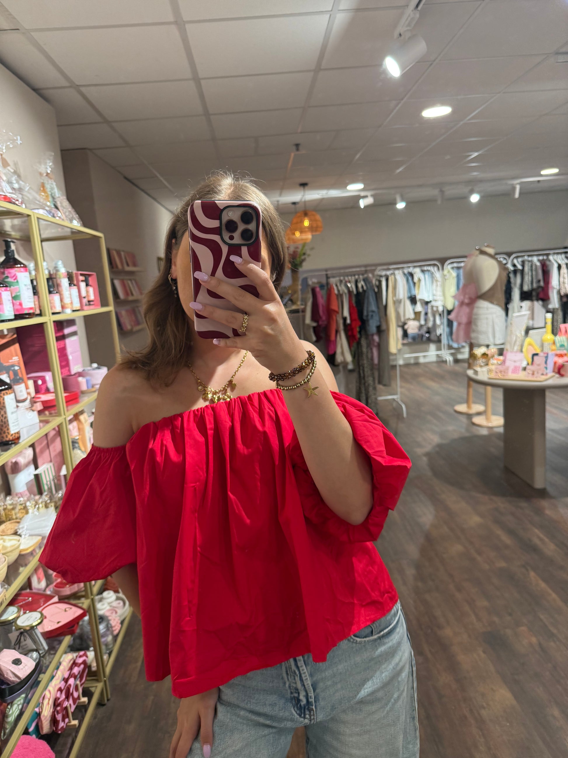 Elegante top met blote schouder 