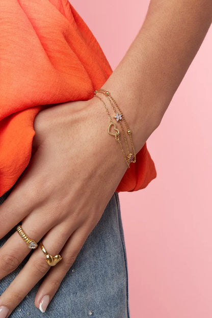 Verbonden hart bedel armband goud