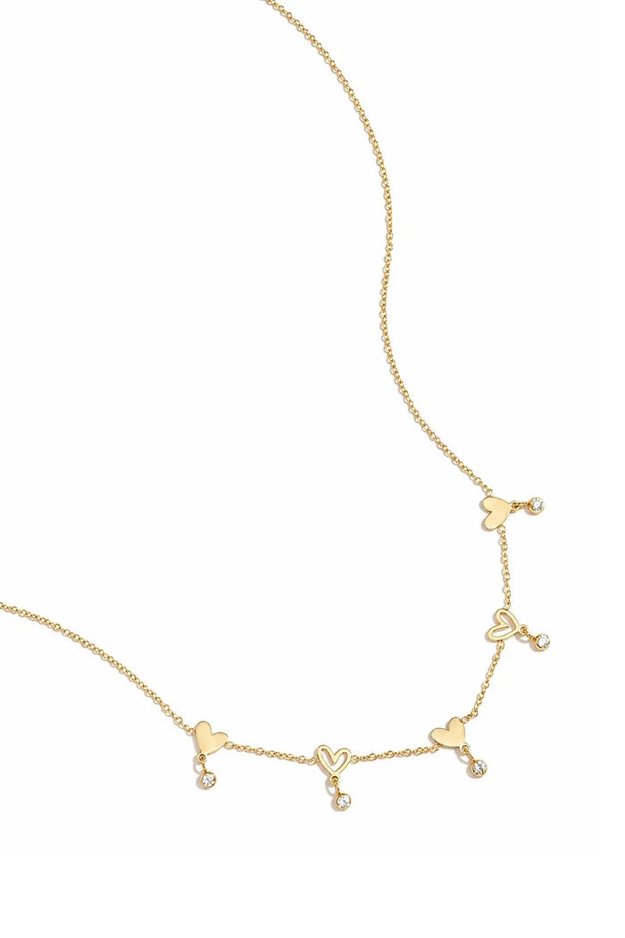 Wisselende hartjes en hangende steentjes ketting goud