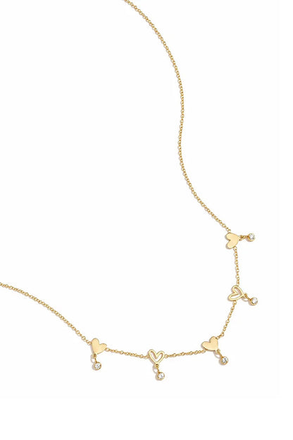 Wisselende hartjes en hangende steentjes ketting goud