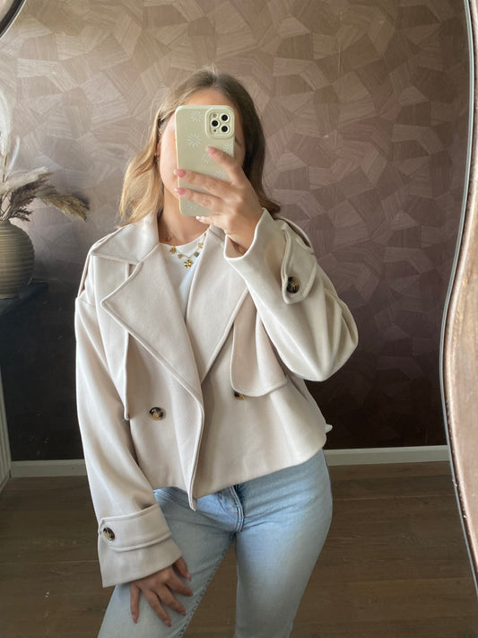 Beige cropped trenchcoat met knopen, stijlvol en modern