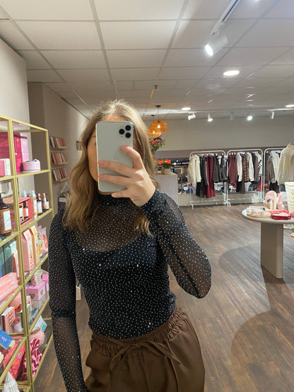 Zwarte mesh body met zilveren glitter, perfect voor een avondje uit of party.